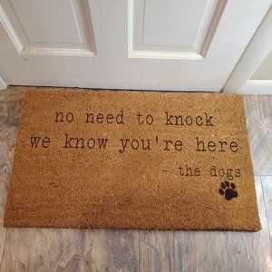 No need to knock, we know you're here. the dogs Door Mat